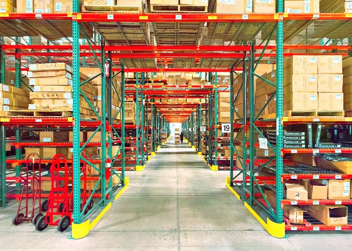 A warehouse is filled with shelves and boxes.